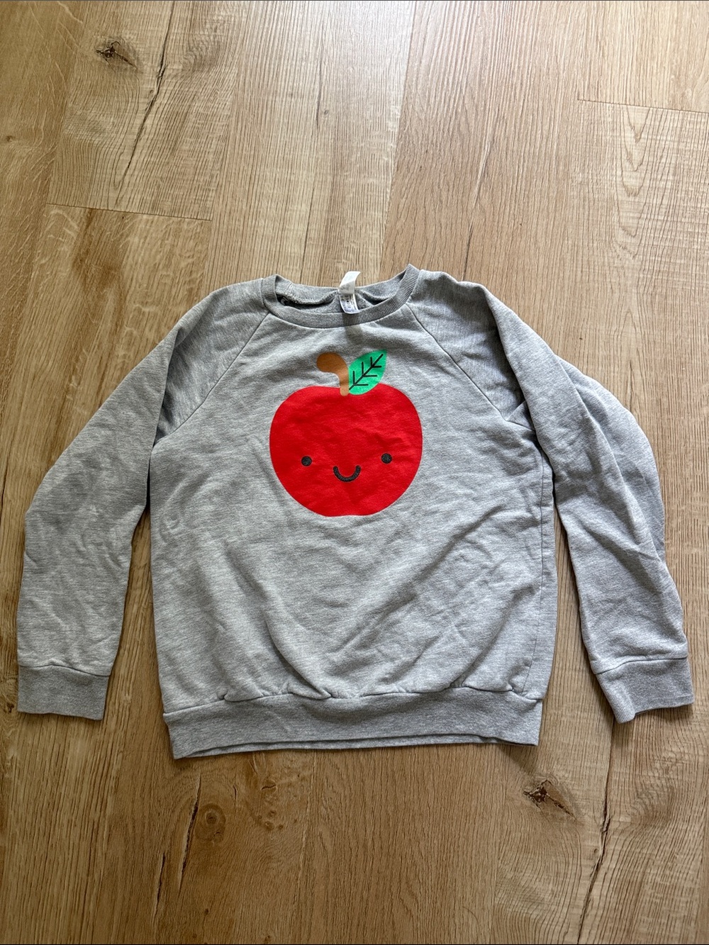 Whistle & Flute Gray Sweatshirt with Red Apple Motif